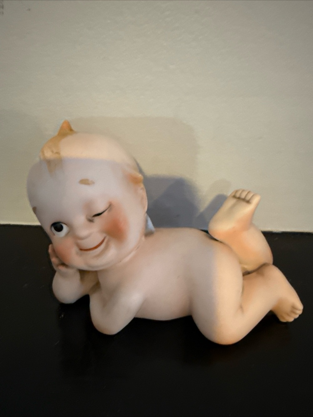 Lefton Cream and Peach Reclining Winking Baby Figurine
